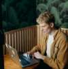 Man with glasses buying B2B e-commerce system online