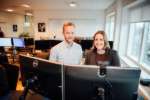 Julie and Mathias using a computer
